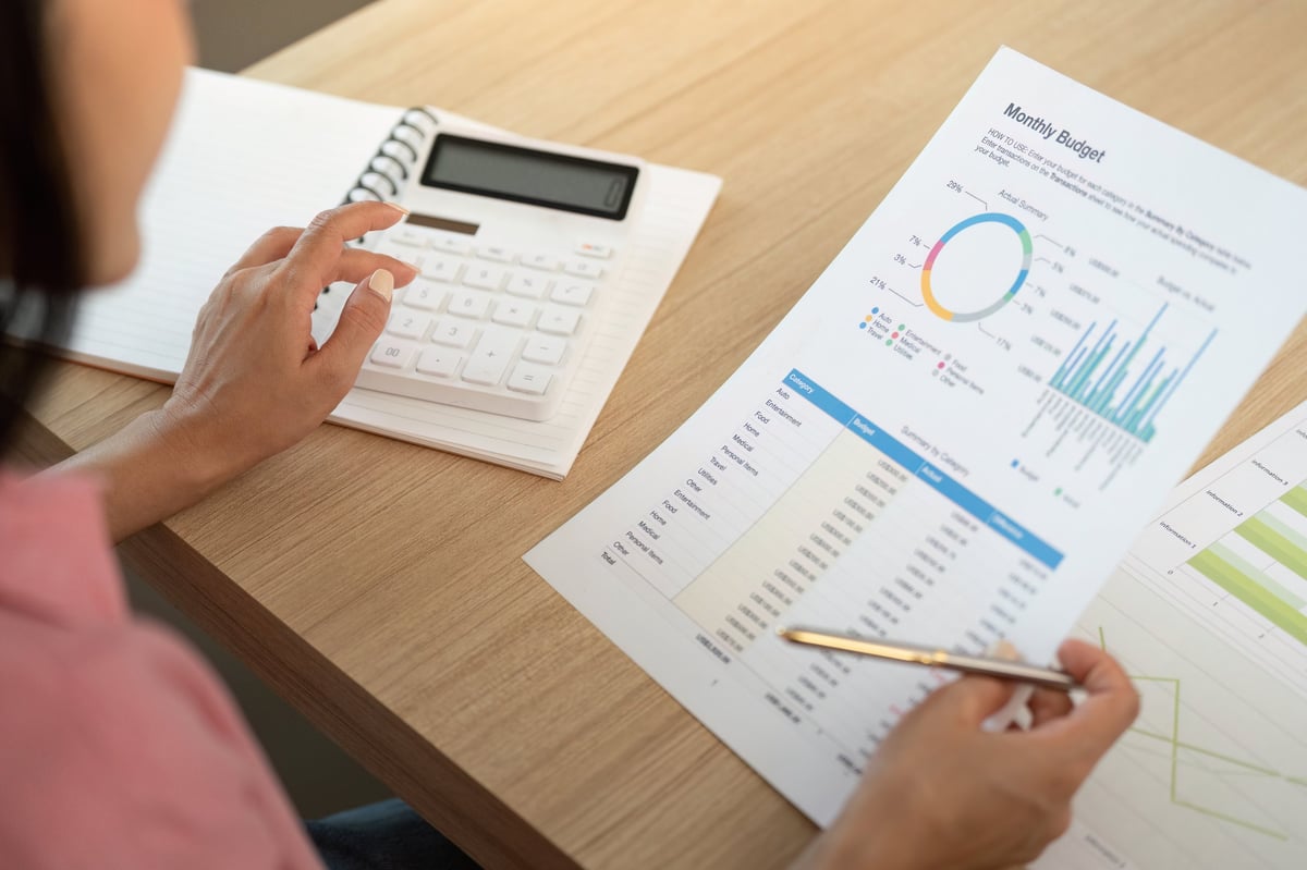 A woman reviewing her finances and budget — representing the self-assessment and financial awareness the Lyceum teaches